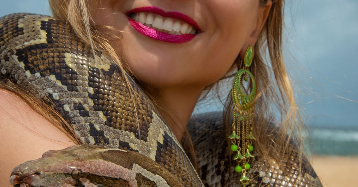 Beach Python Drawing Woman Embracing Python on Beach ยท Free Stock Photo