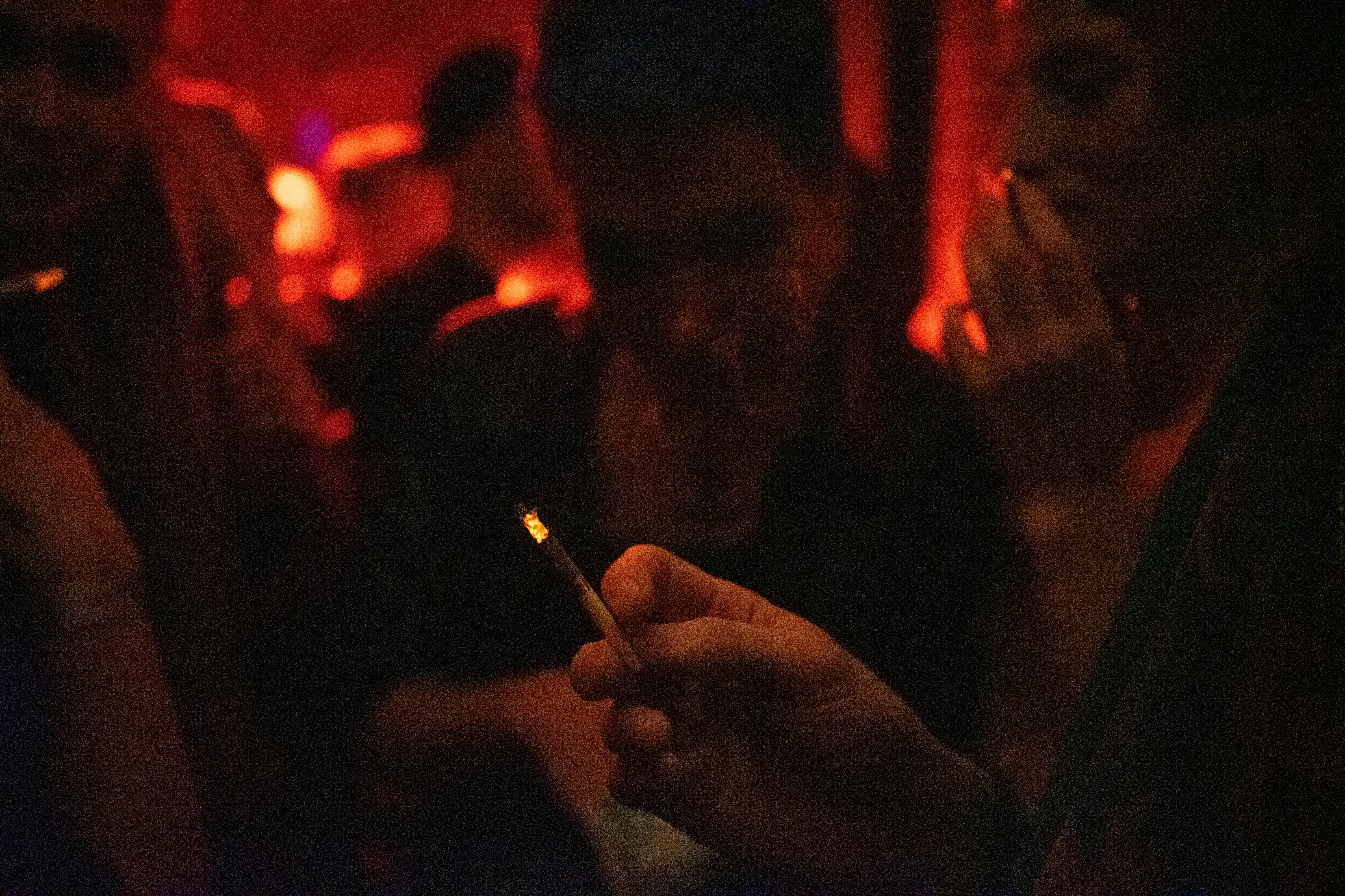 person holding cigarette