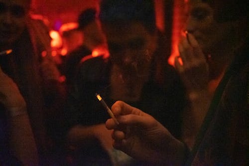 Person Holding Cigarette