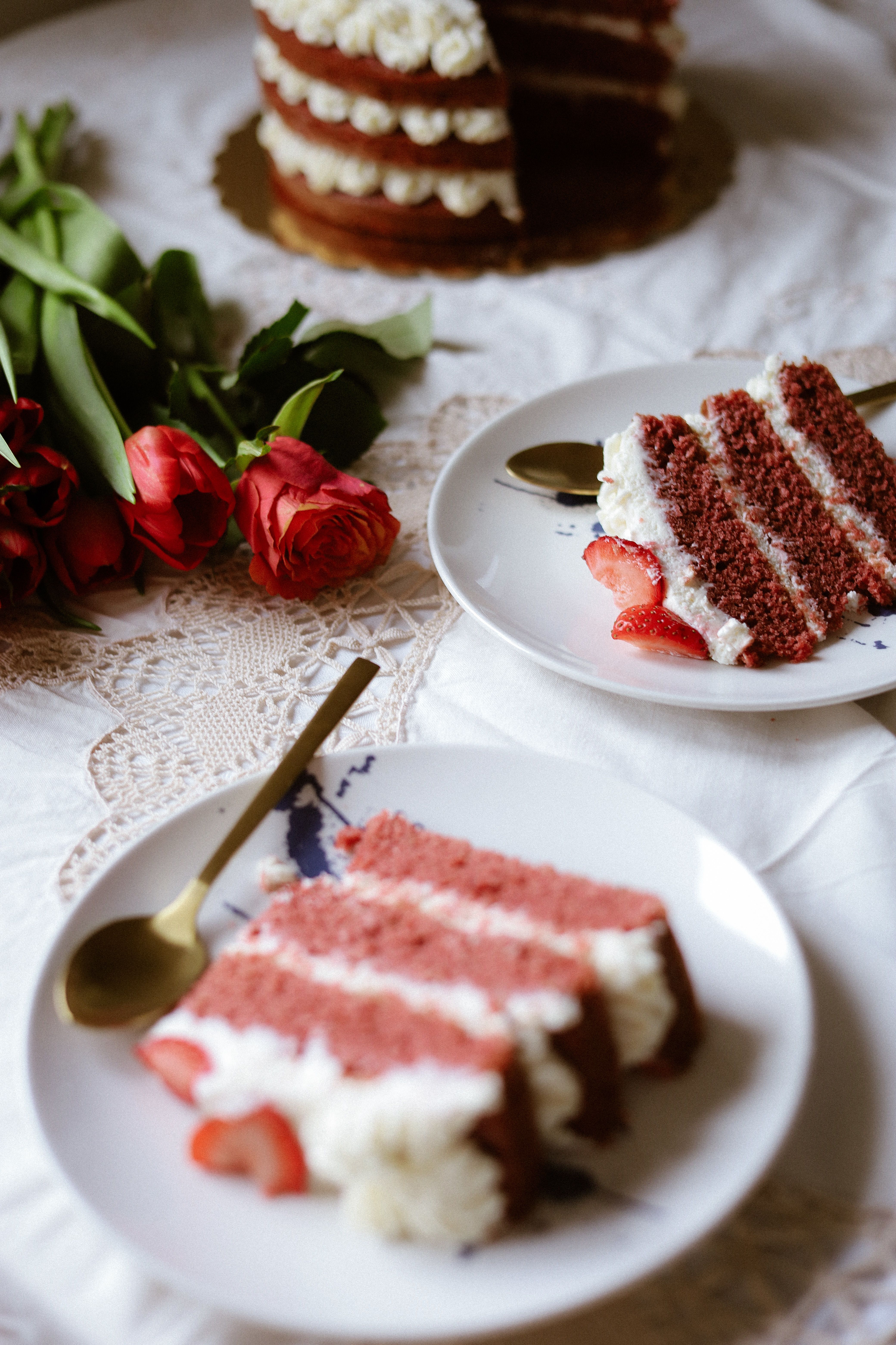 Elegant Red Velvet Cake with Roses Setup · Free Stock Photo