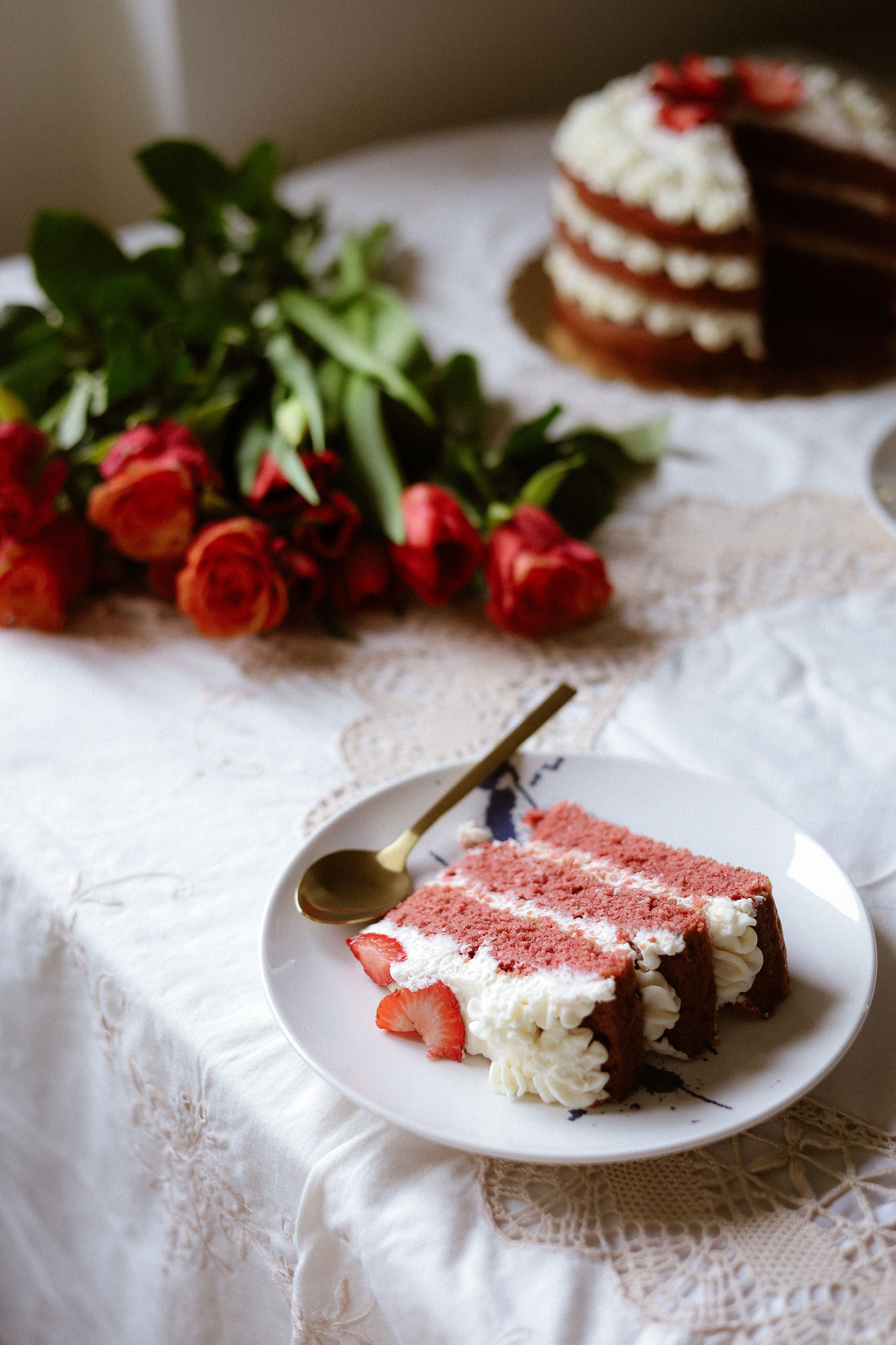 Elegant Red Velvet Cake and Roses on Table · Free Stock Photo