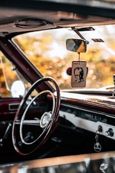 Explore a classic car's dashboard and steering wheel, capturing a nostalgic vibe.