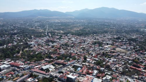 Free Stunning aerial view capturing the sprawling town of Tequisquiapan with mountains in the background. Stock Photo