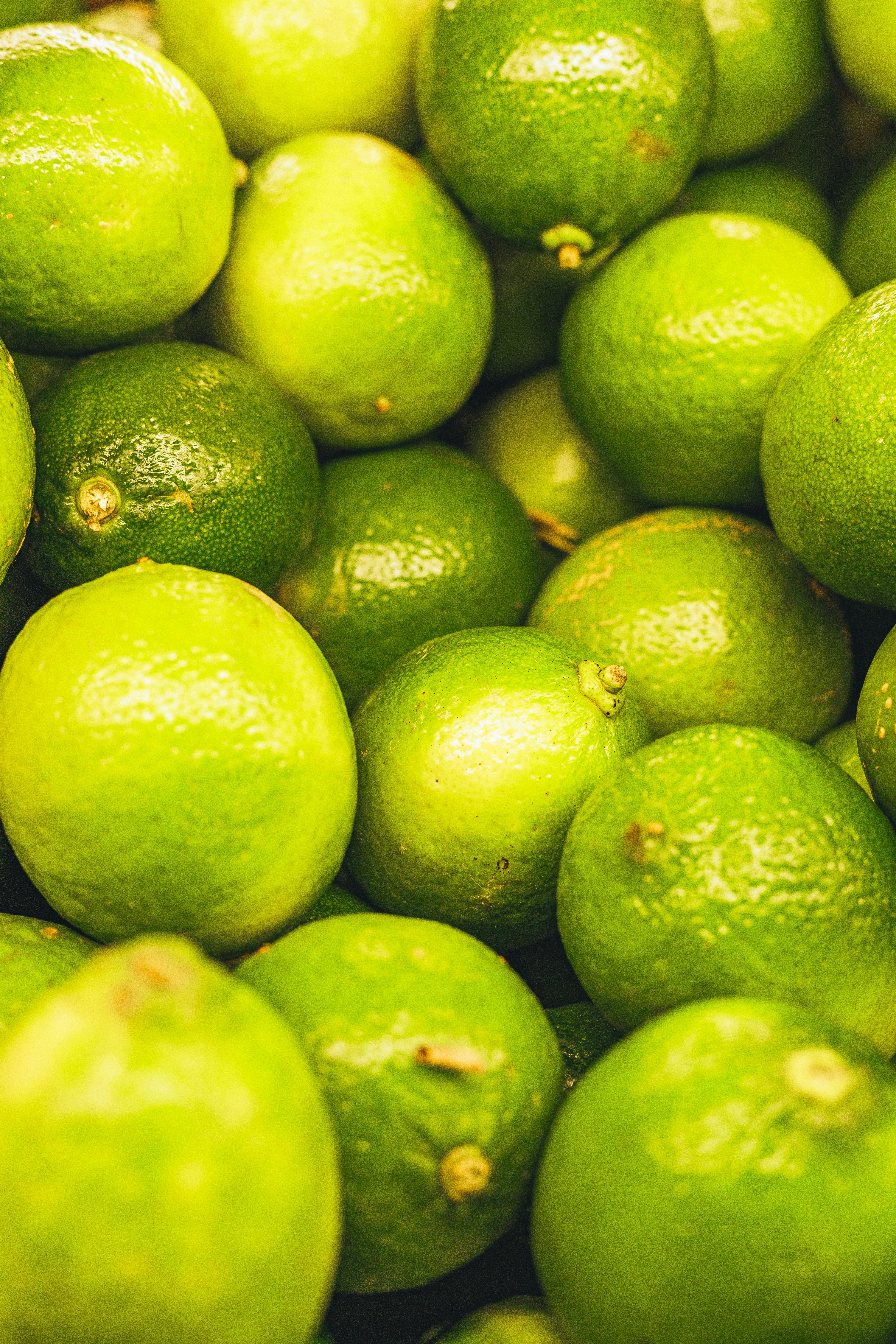 Close-up of vibrant green limes showing texture and freshness.