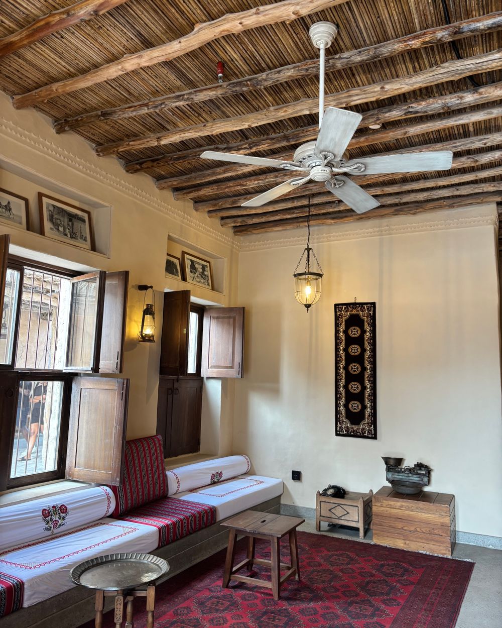 Cozy traditional Arabic-style room with rustic decor and cultural elements.