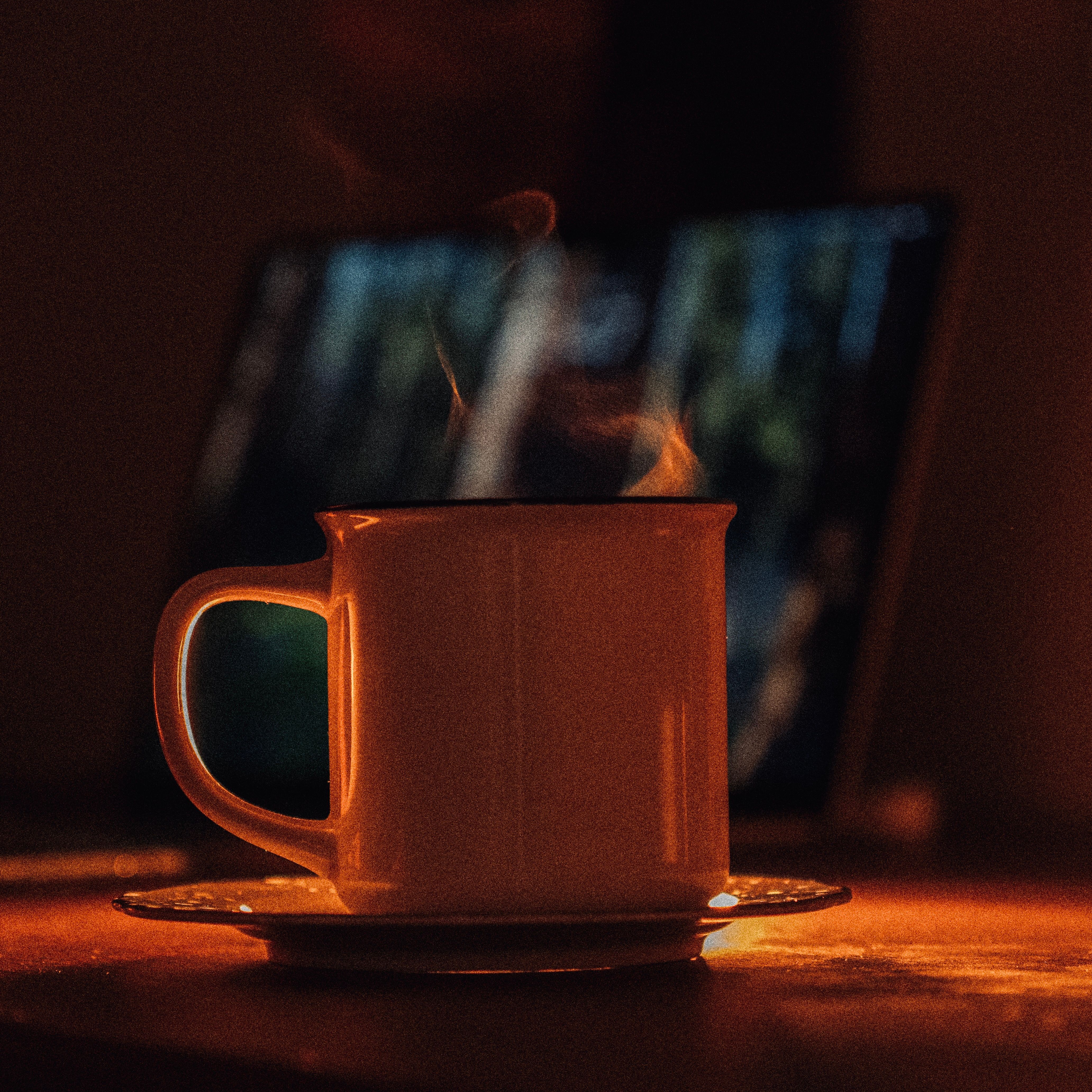 Warm ambiance with a steaming cup of tea on a cozy evening, perfect for relaxation.