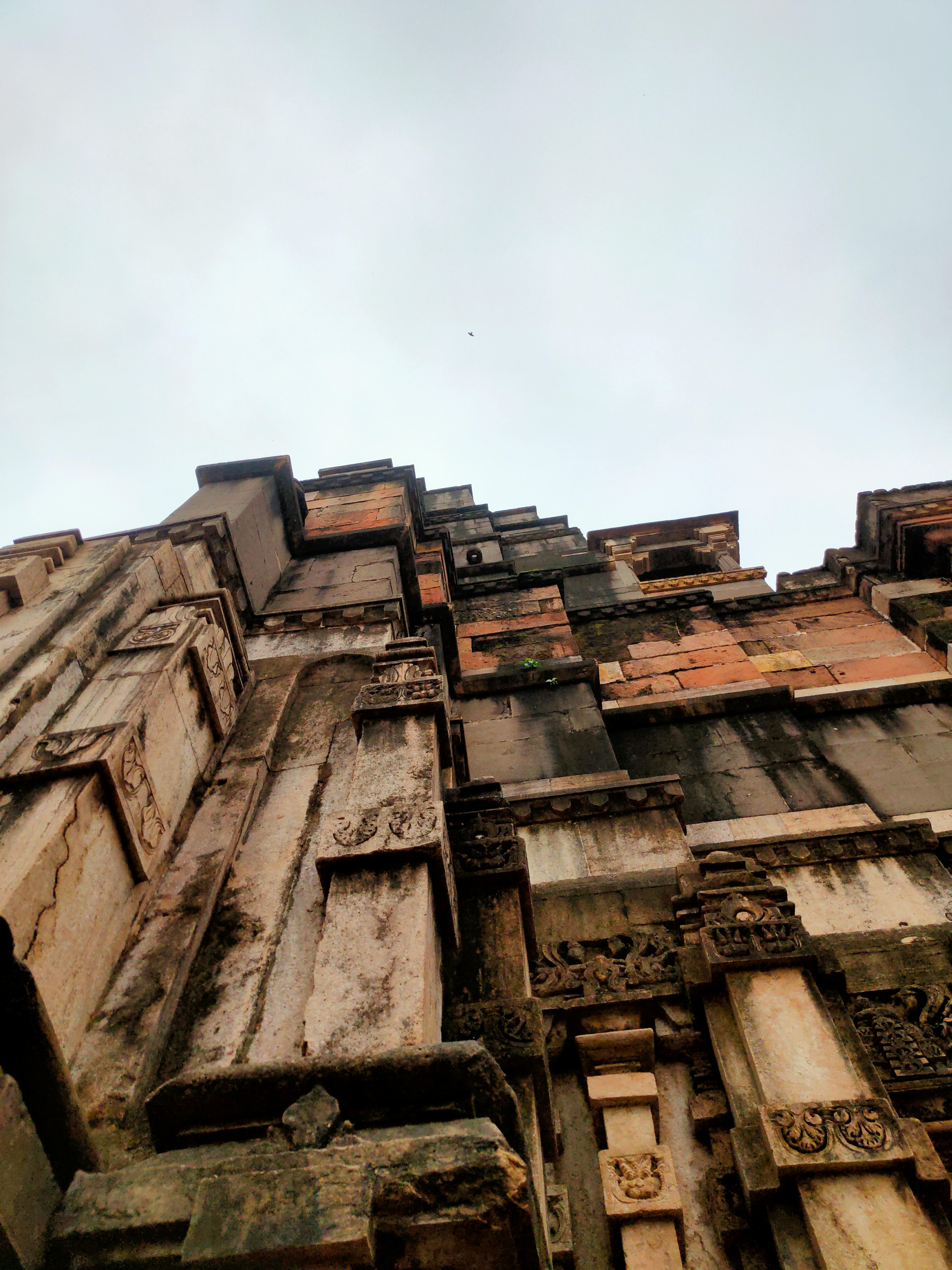 ancient architectural detail against cloudy sky