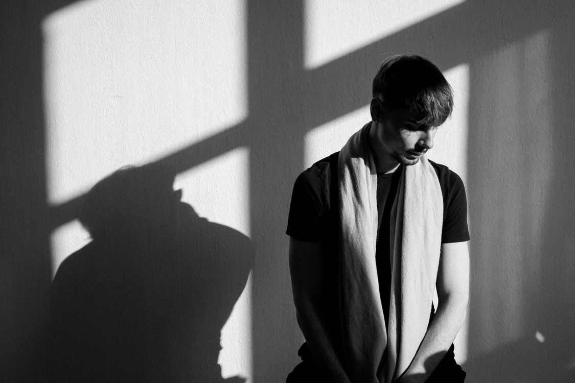 Dramatic Shadows Portrait Contemplative Portrait with Dramatic Shadows · Free Stock Photo