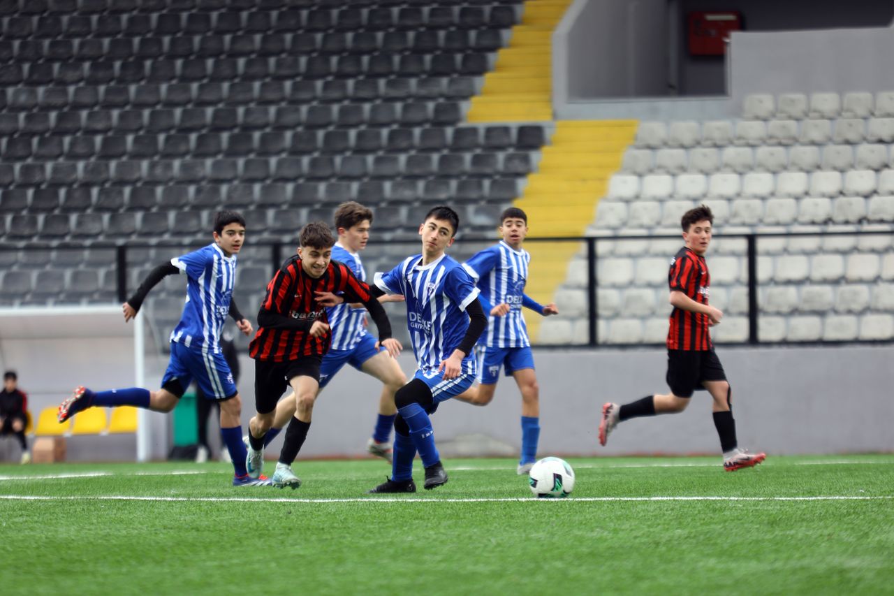 young soccer players in action on a field ideal for sports and teamwor