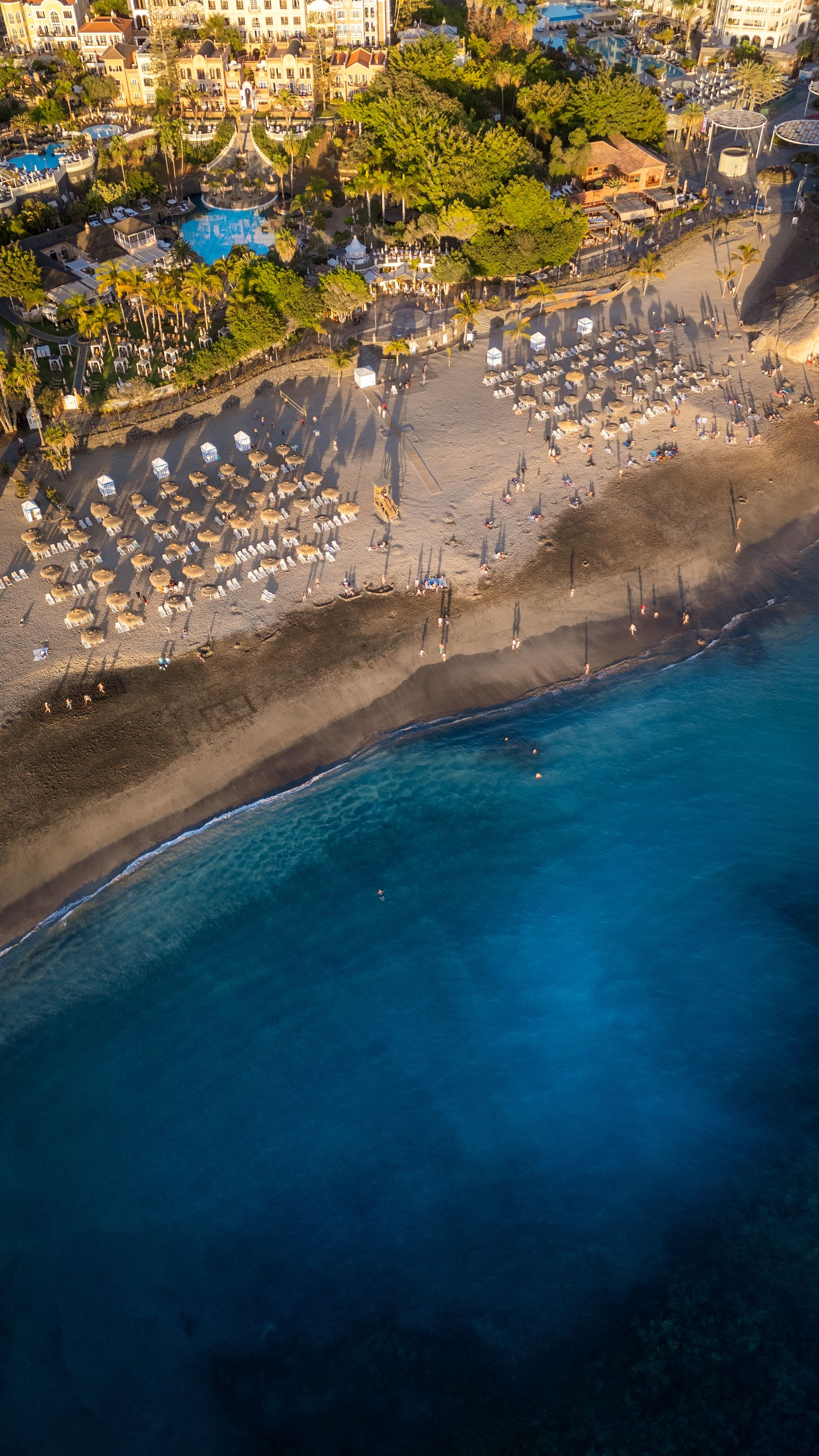 A Tenerife beach and turquoise ocean from above