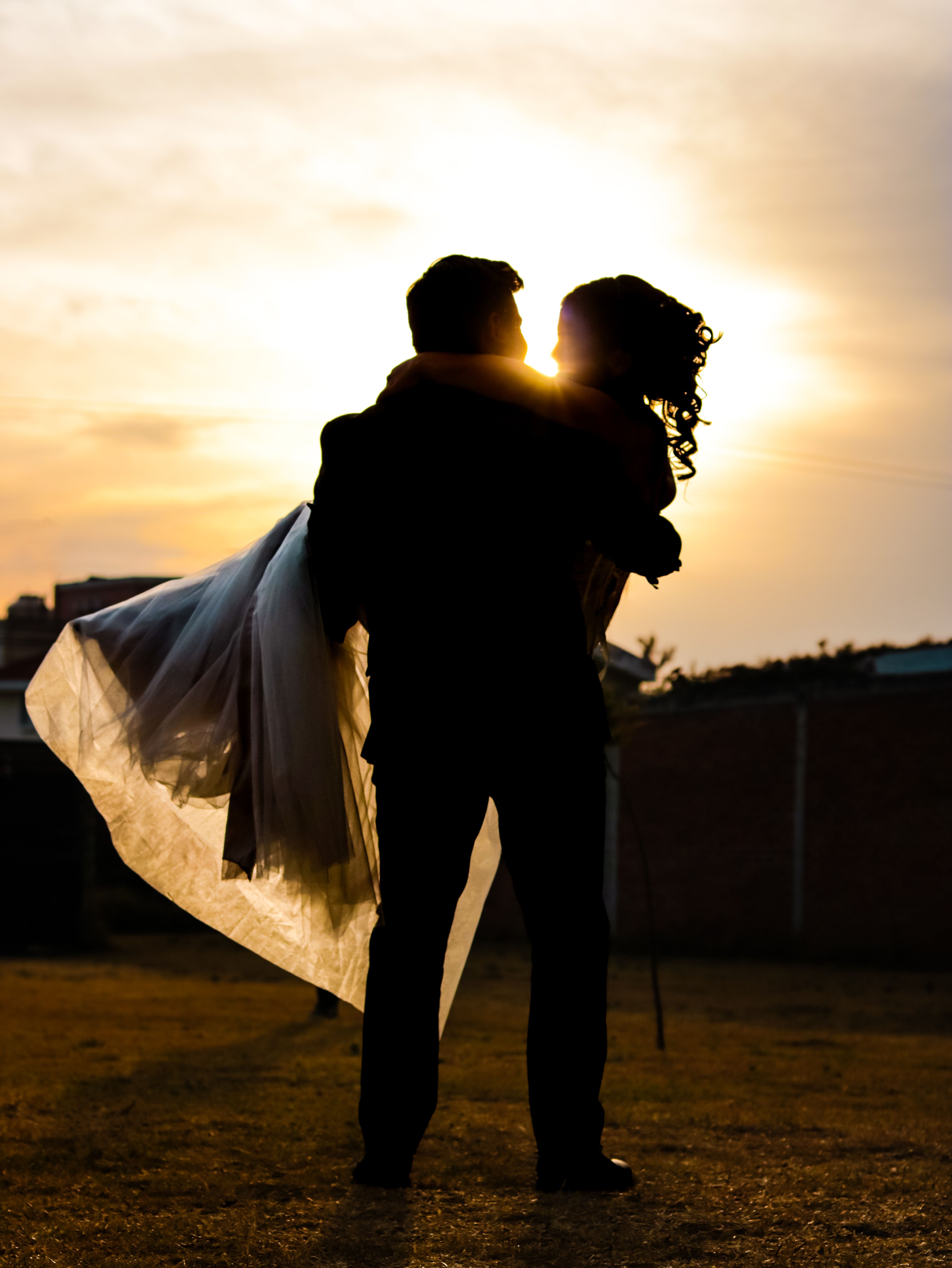 Romantic Wedding Silhouette at Sunset · Free Stock Photo