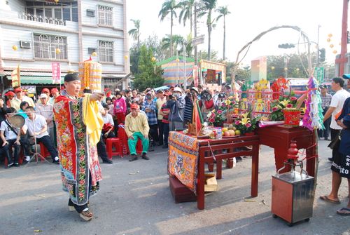 Free Colorful traditional ceremony with crowd observing in an outdoor setting. Stock Photo