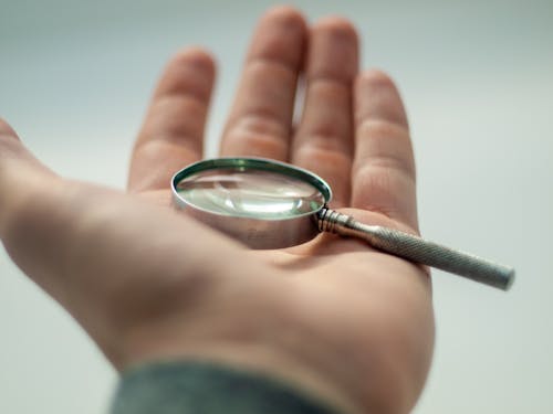 Free Selective-Focus Photo Of Magnifying Glass Stock Photo