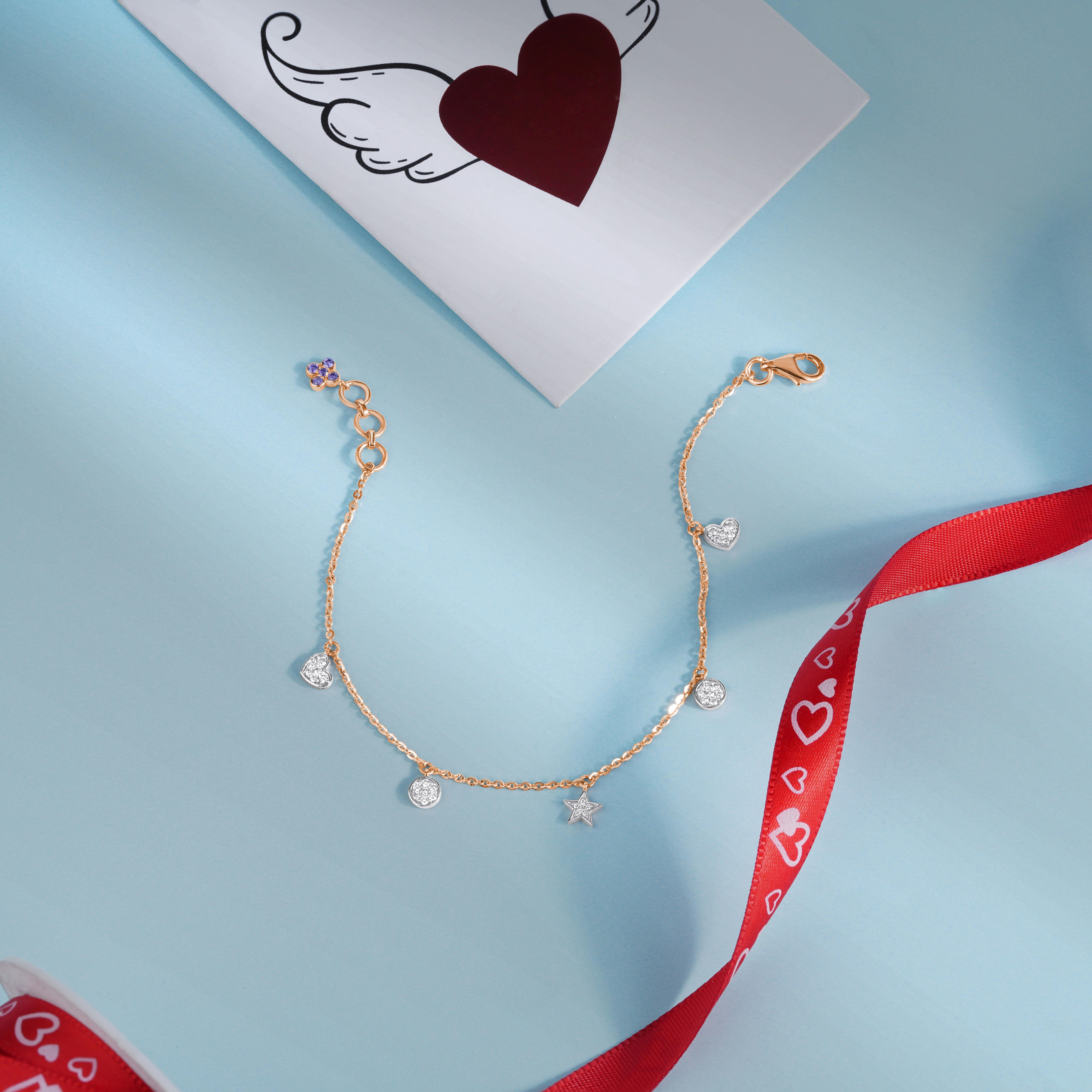 Free Elegant gold and diamond bracelet perfect for Valentine’s Day gifts, featuring heart motifs. Stock Photo