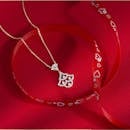 Elegant Diamond Pendant on Red Heart Ribbon