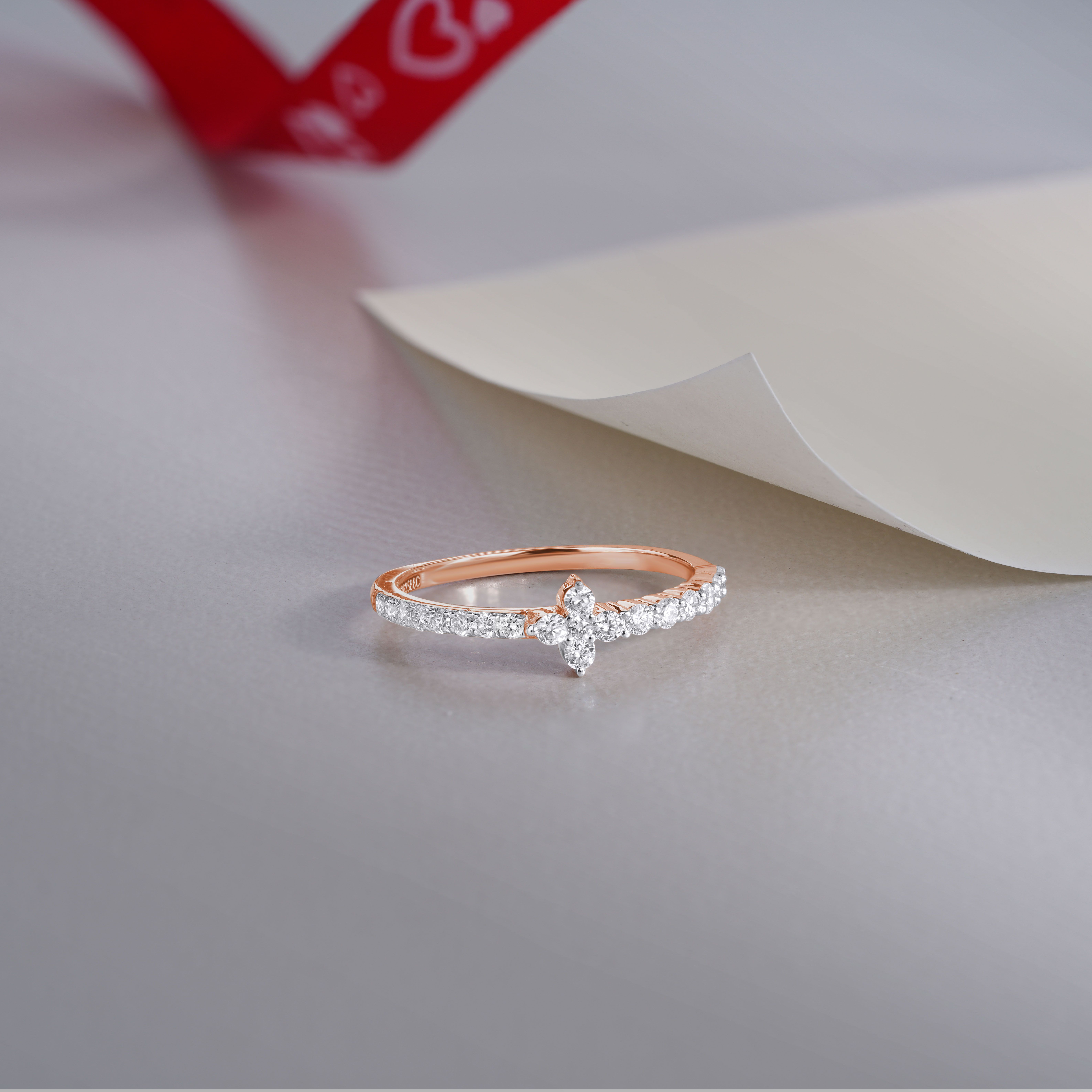 elegant diamond ring with gift ribbon