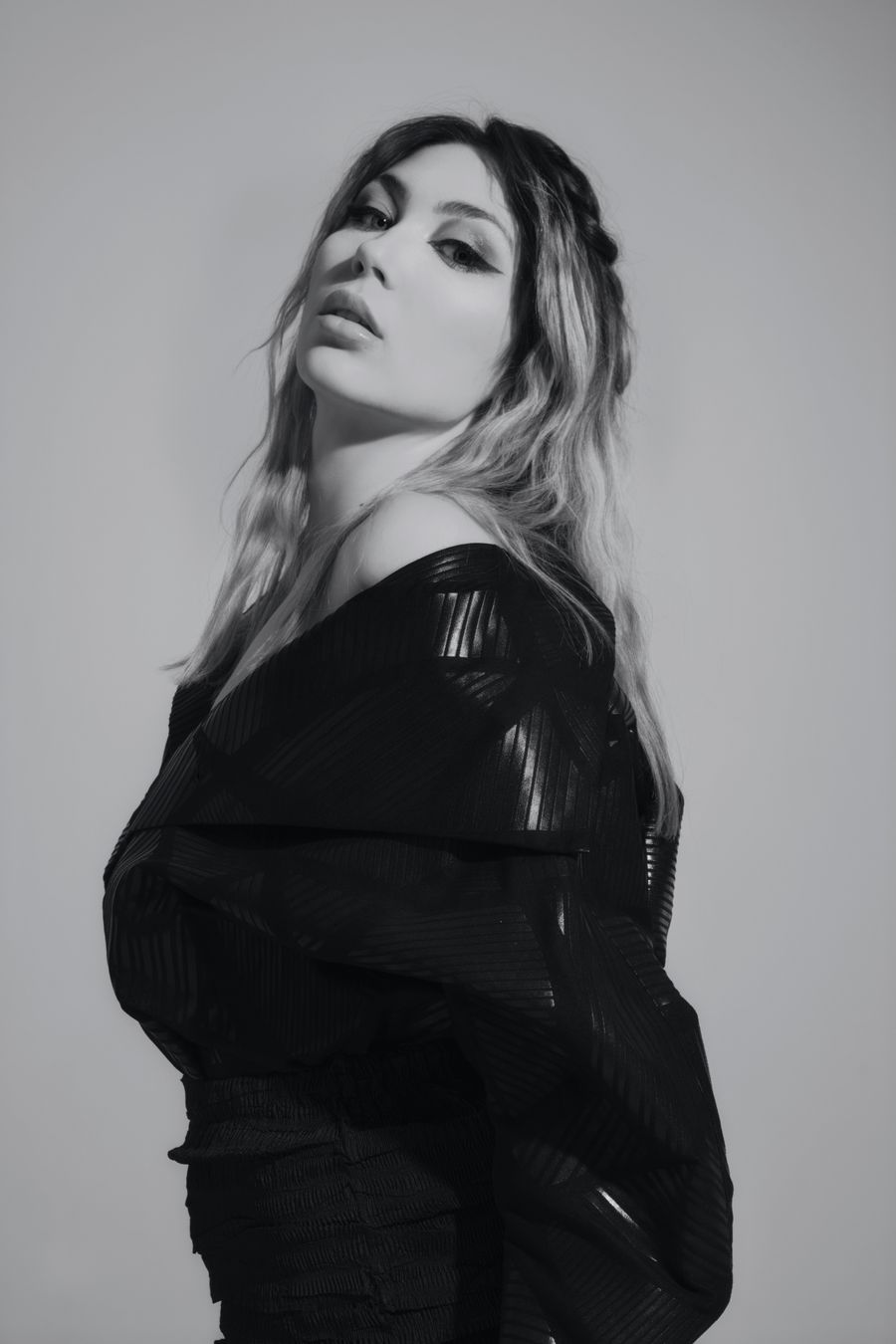 Monochrome portrait in a dark structured coat