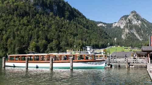 Free A picturesque scene of a boat moored at Königssee with Bavarian Alps as a backdrop, in Schönau am Königssee, Germany. Stock Photo