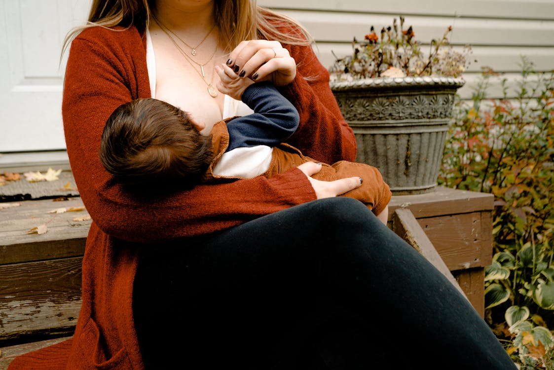 Free Mother Breastfeeding her Child Stock Photo