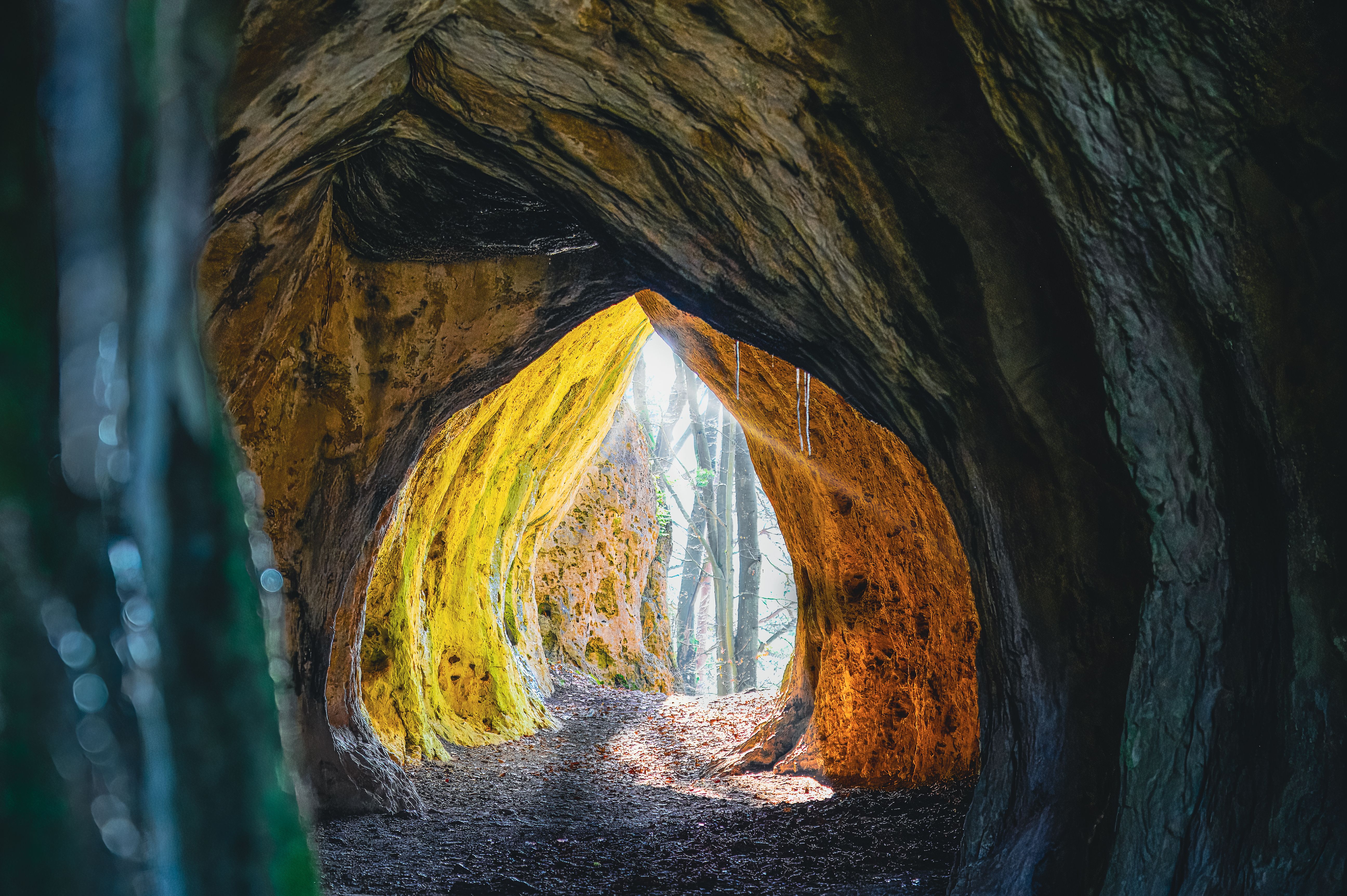 Mystical Cave Entrance with Sunlit Pathway · Free Stock Photo