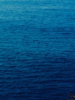 Tranquil view of the deep blue ocean surface in Goa, India, ideal for wallpapers.