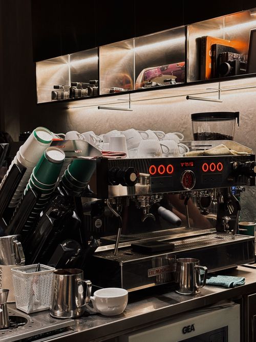 Free Espresso machine setup with cups and accessories in a Jakarta cafe. Stock Photo