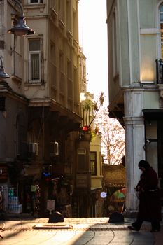 A peaceful Istanbul street captured during a golden sunset with historical architecture and subtle city life.