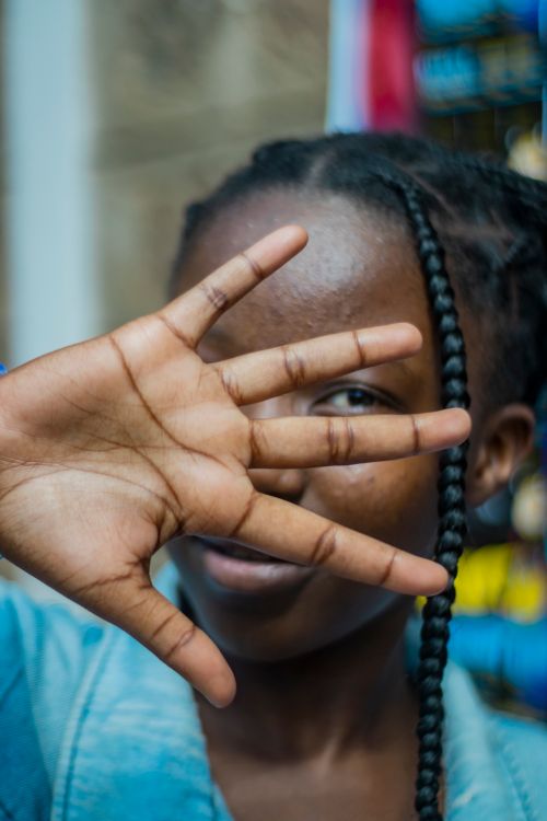 Close-Up Portrait of a Young Woman with Braids · Free Stock Photo