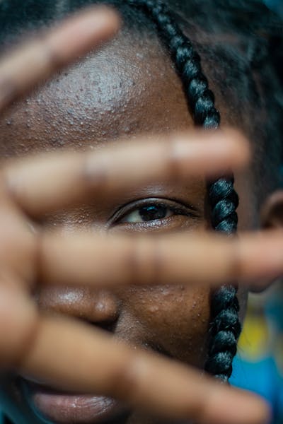 "A Kenyan fashion designer collaborating with a local artist