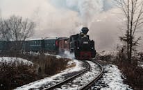Vintage Steam Train in Snowy Maramures Landscape