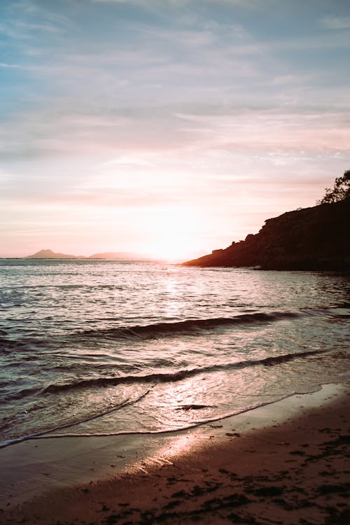 Photo Of Seashore During Dawn