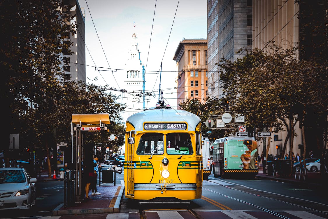 Free Tram Stopping Before Pedestrian Stock Photo