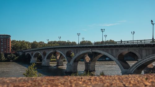 Free Scenic view of Pont Saint-Pierre bridge crossing the Garonne River in Toulouse, France. Stock Photo