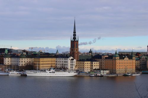 Free Beautiful view of Riddarholmen with churches and boats in Stockholm, Sweden. Stock Photo