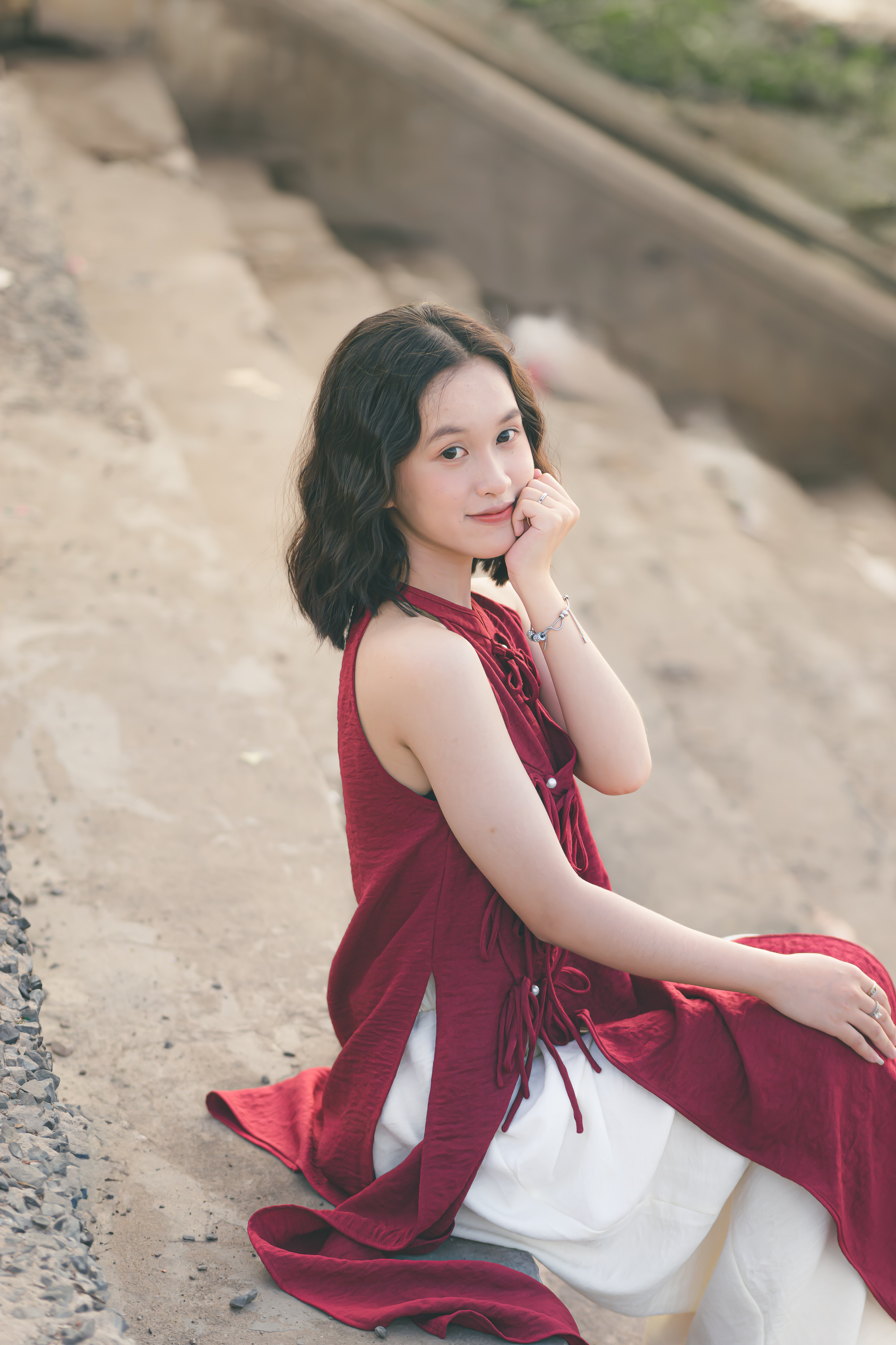 Young Woman Posing Outdoors in Red Dress · Free Stock Photo