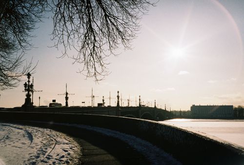 Free Sunlit winter view of a bridge in St. Petersburg with snow and clear sky. Stock Photo