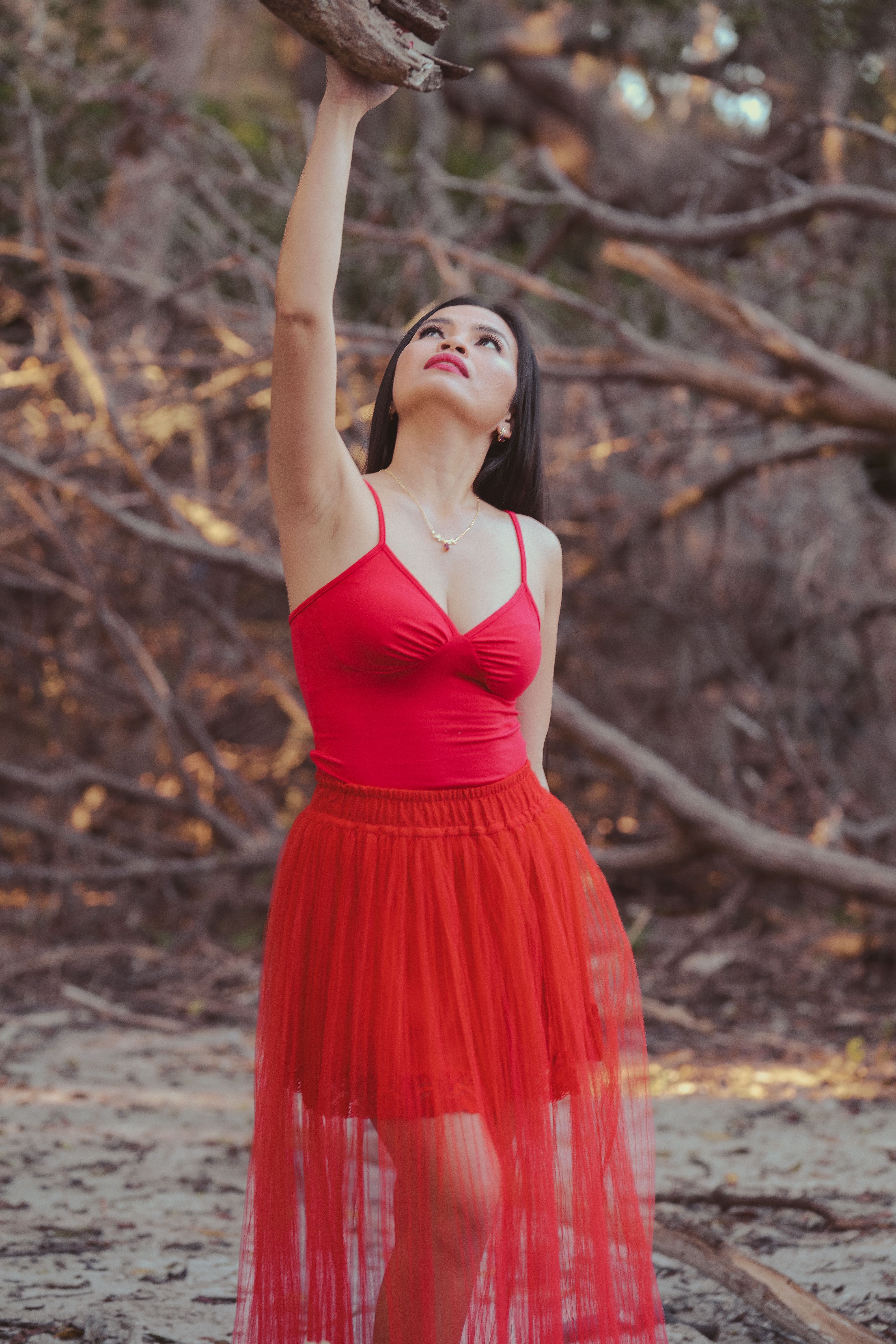 Elegant Woman in Red Dress Outdoors · Free Stock Photo