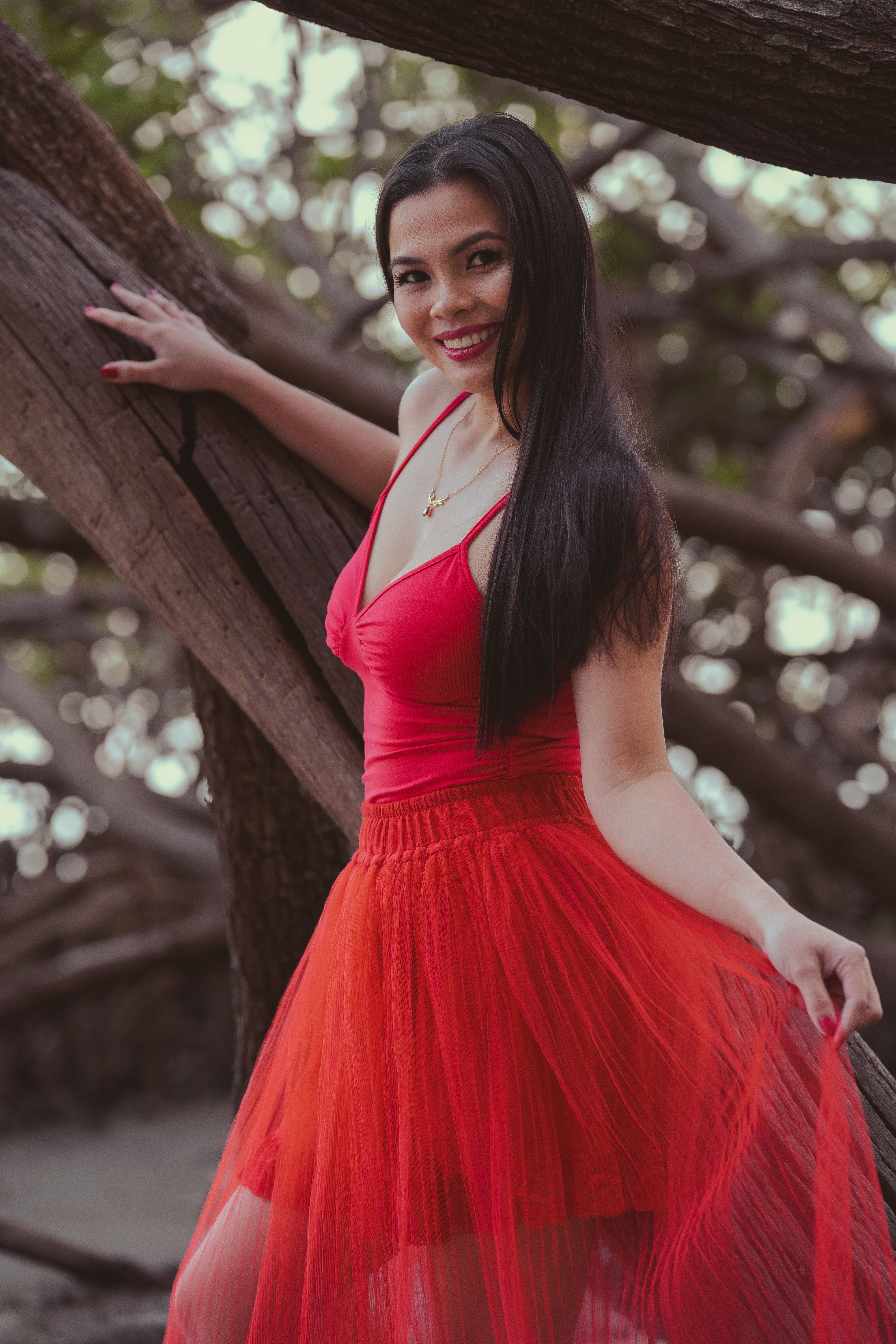 Elegant Woman in Red Dress Outdoors · Free Stock Photo