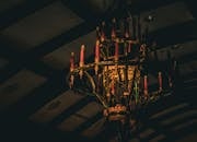 Vintage Candlelit Chandelier in Dimly Lit Room