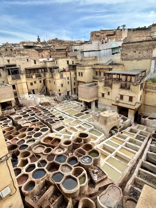 Free Explore the vibrant colors and textures of the historic Fez tannery in Morocco's cultural heart. Stock Photo