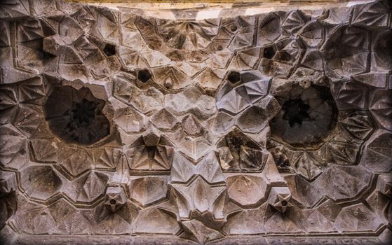 Close-up of intricate geometric stone patterns in Kırşehir, Türkiye, showcasing ancient artistry.