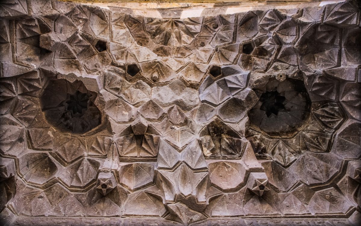 Geometric Patterns Historic Intricate Geometric Patterns on Historical Stone · Free Stock Photo