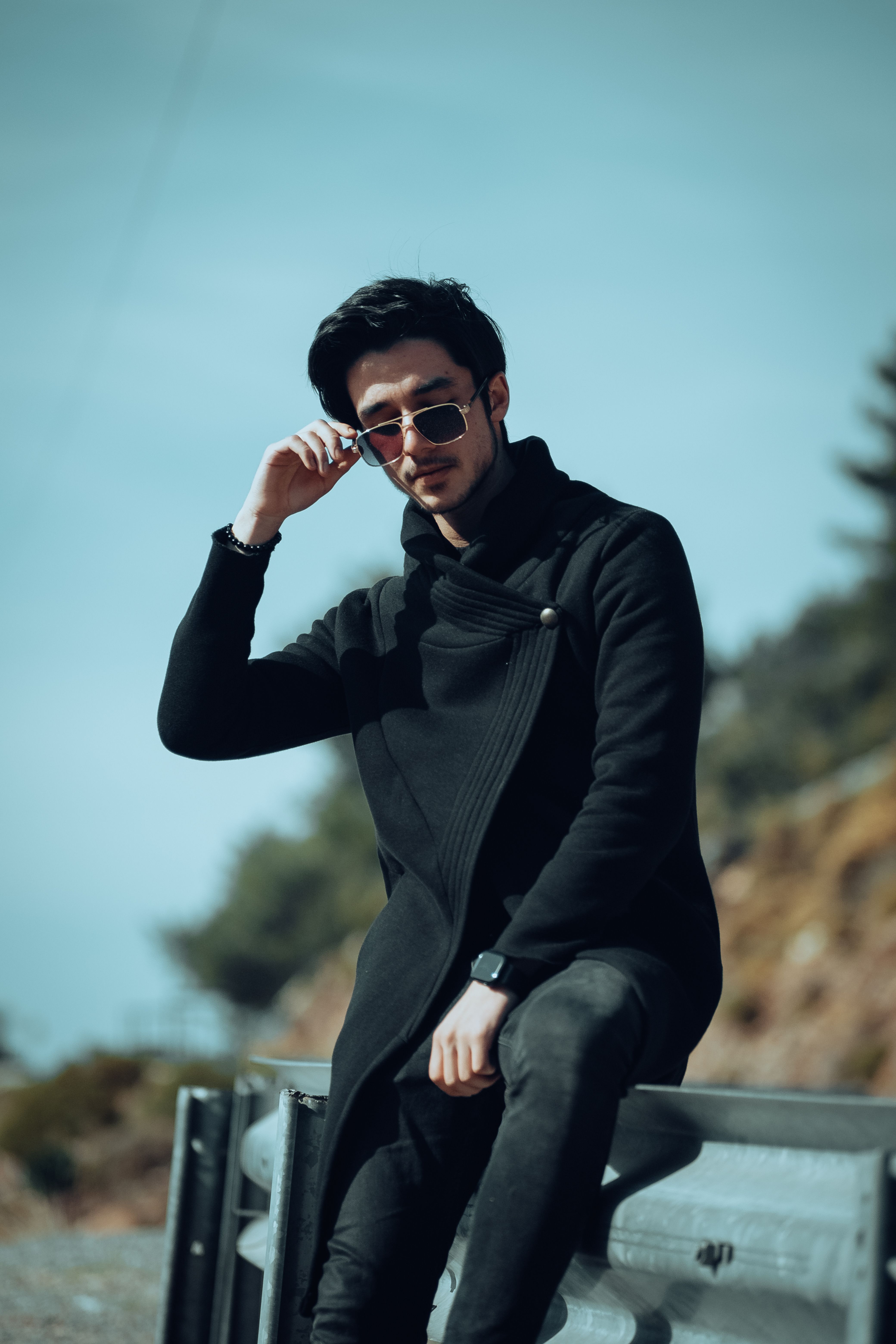 Stylish Young Man Posing Outdoors in Sunglasses · Free Stock Photo