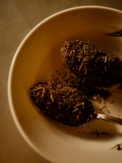 Free Rustic close-up of herbal tea leaves in a ceramic bowl with spoons, warm tones. Stock Photo