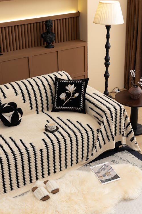 Free Cozy living room with a modern striped sofa cover and elegant decor in Salt Lake City. Stock Photo