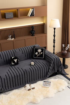 Contemporary living room featuring a stylish sofa with decorative cushions and elegant lighting in Salt Lake City.