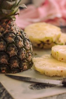 Close-up of fresh pineapple slices with vibrant colors, perfect for tropical recipes.