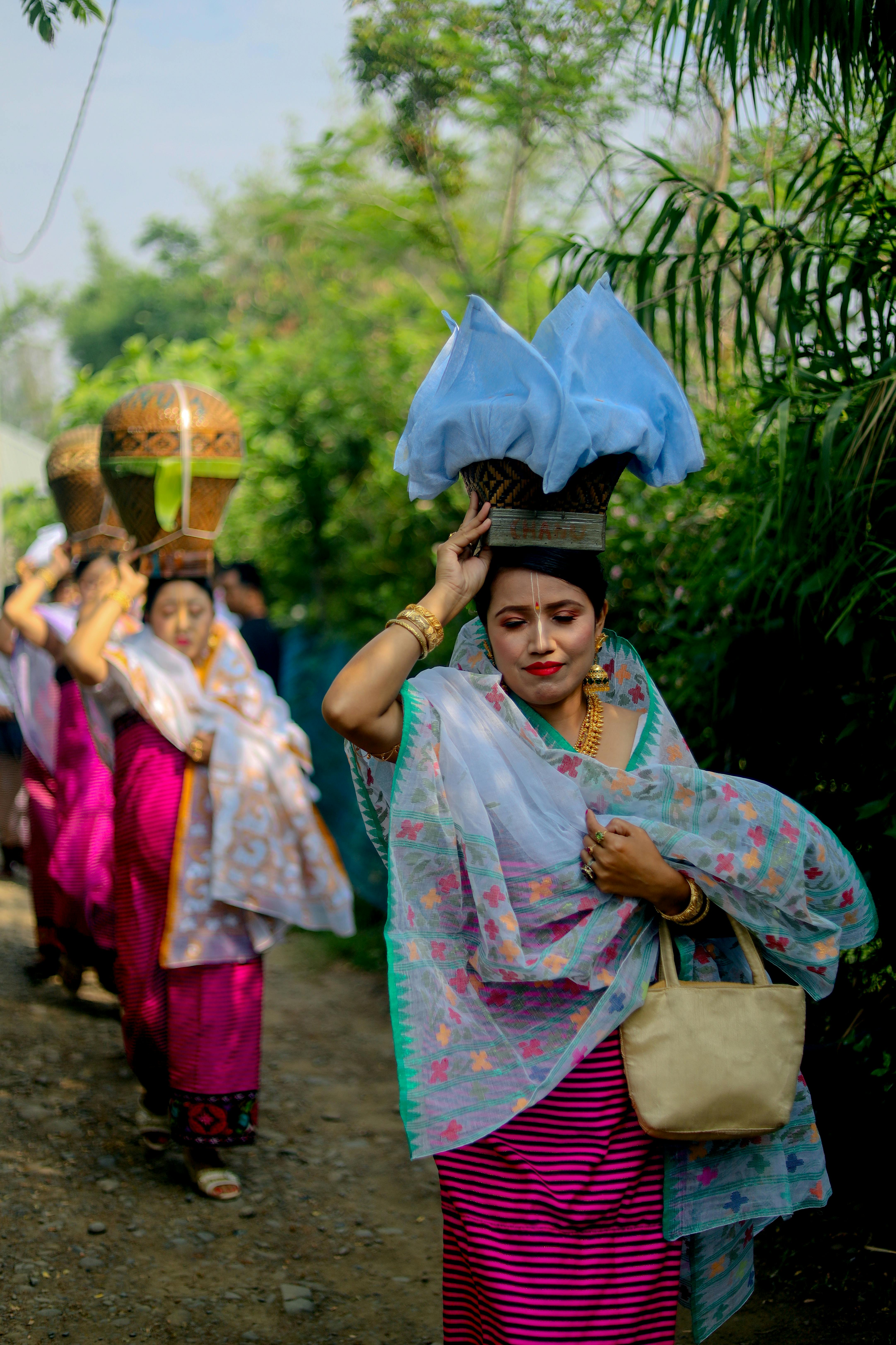 Women in traditional attire participate in a cultural procession in Manipur, India