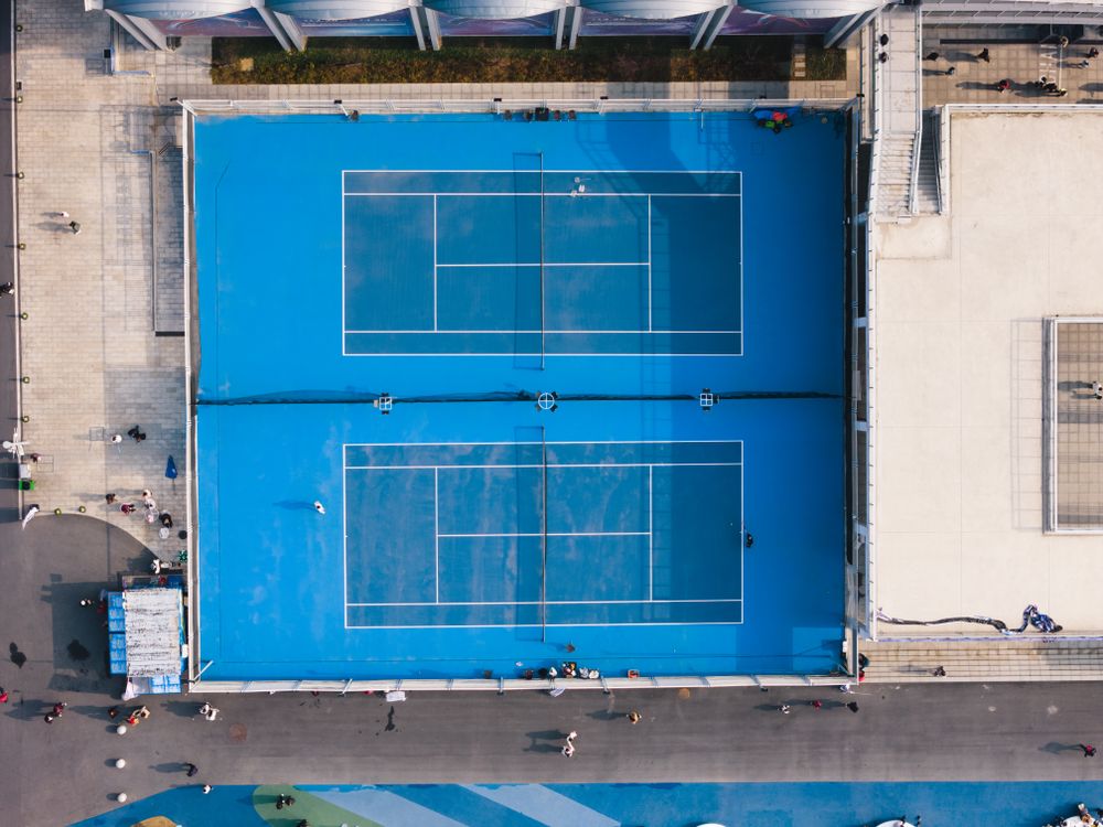 Aerial view of outdoor community tennis courts — swim and tennis club facility management