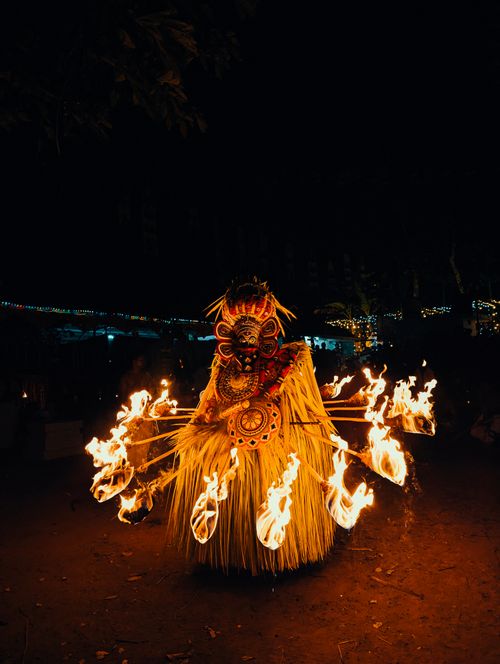 Free A vibrant Theyyam dance performance showcasing fire ritual at night in Kerala, India. Stock Photo